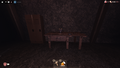 An Alarm Clock on a table in The Mines, facing backwards.