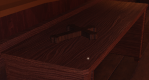 Crucifix on a table.png
